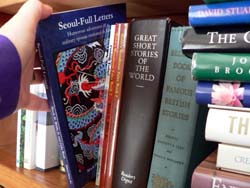 Picking a good book to read. Picking a good book to read.